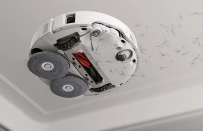 Robot vacuum from below showing cleaning action