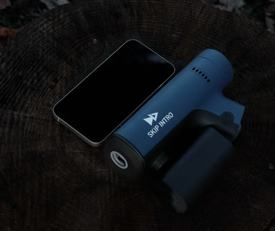 Device on tree stump with smartphone