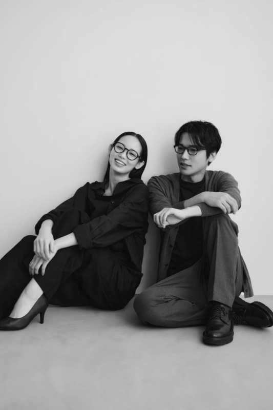 Couple sitting with glasses