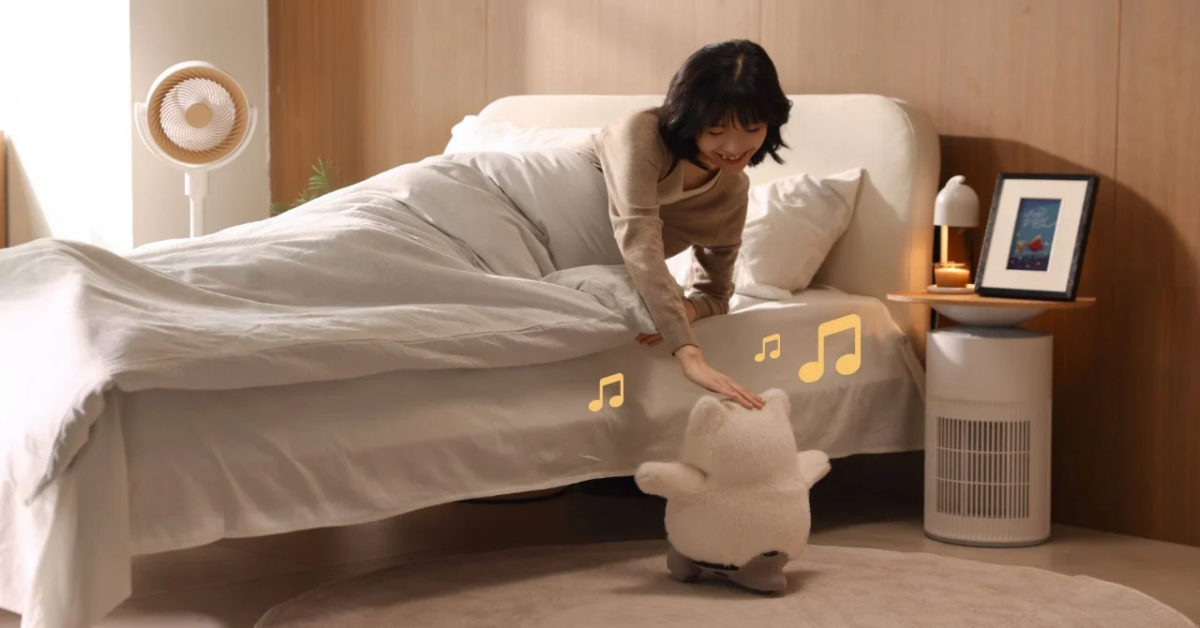 Woman interacting with robot in bed