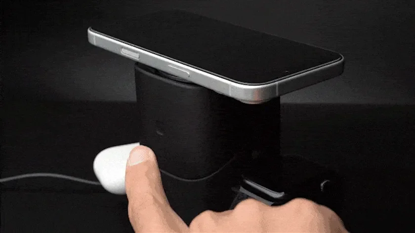 Smartphone and AirPods on wireless charger
