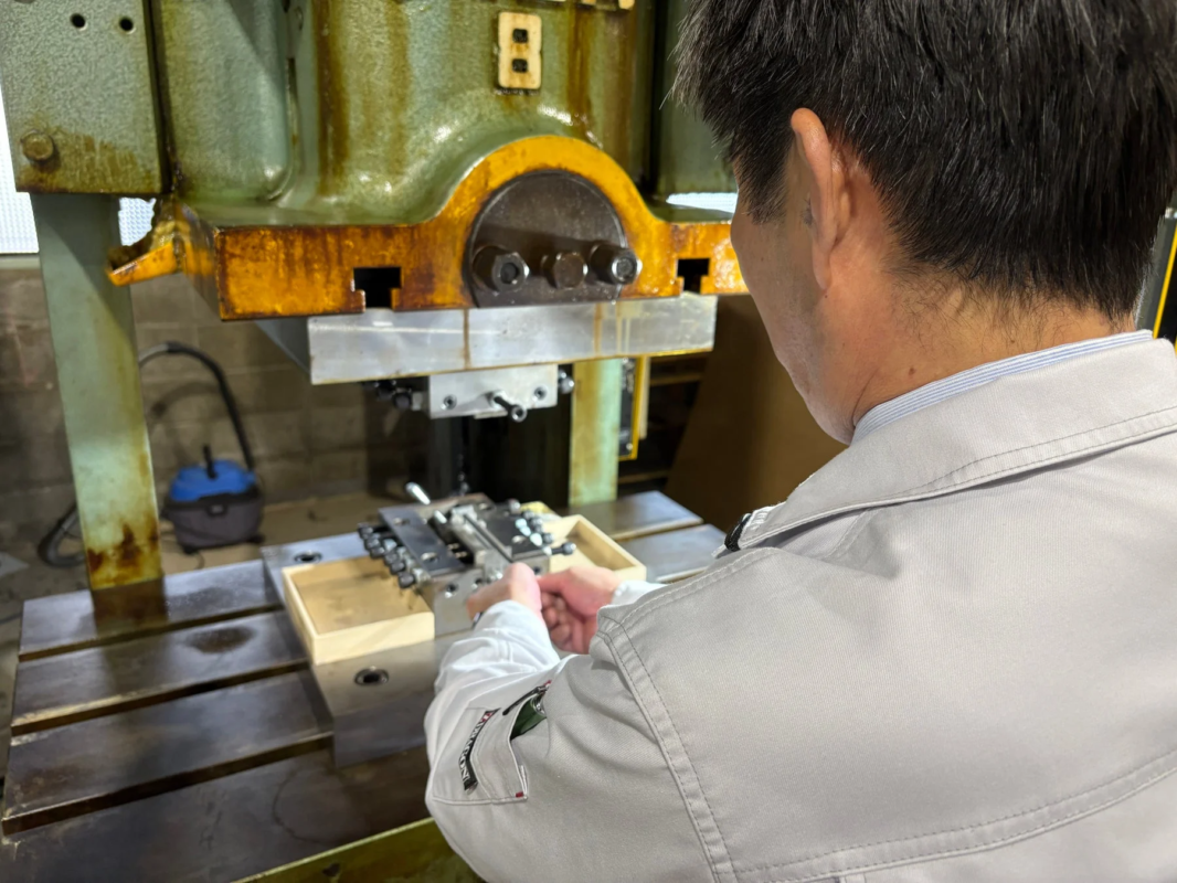 Worker operating machinery in a factory