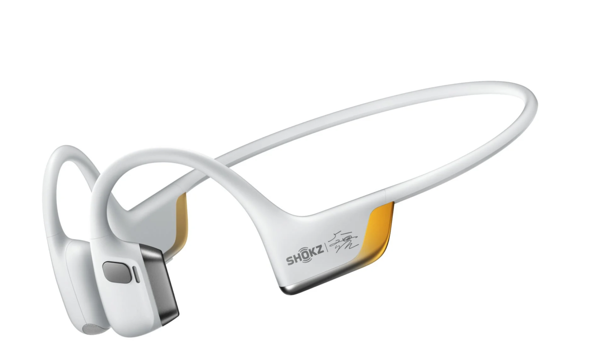 White and gold Shokz bone conduction headphones