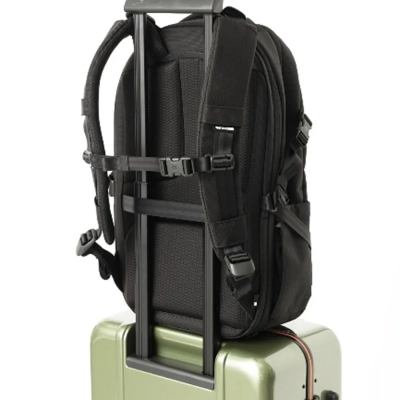 Incase Tracks Expansion Backpack attached to a suitcase