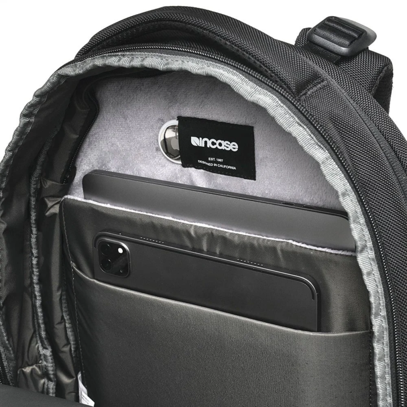 Internal tech pocket with devices in Incase Tracks Expansion Backpack
