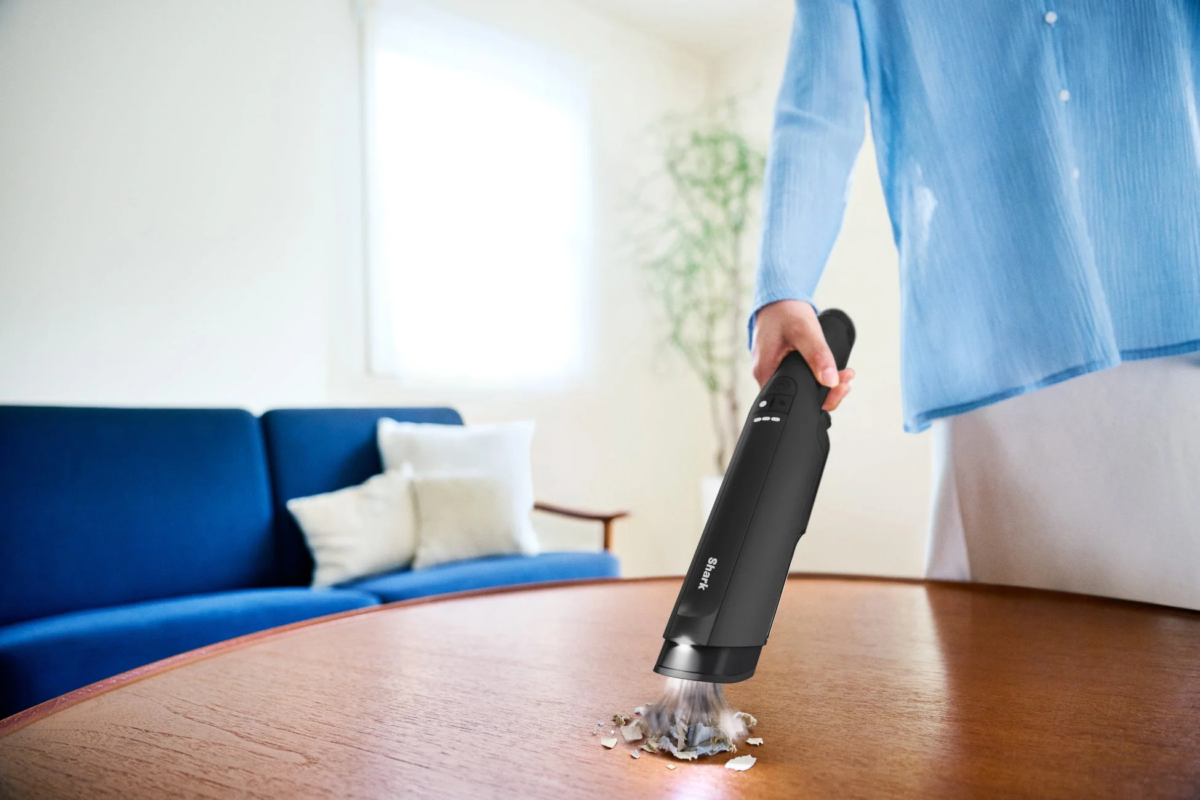 Handheld vacuum cleaning table