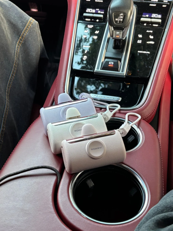 Three RORRY portable devices in car cup holders