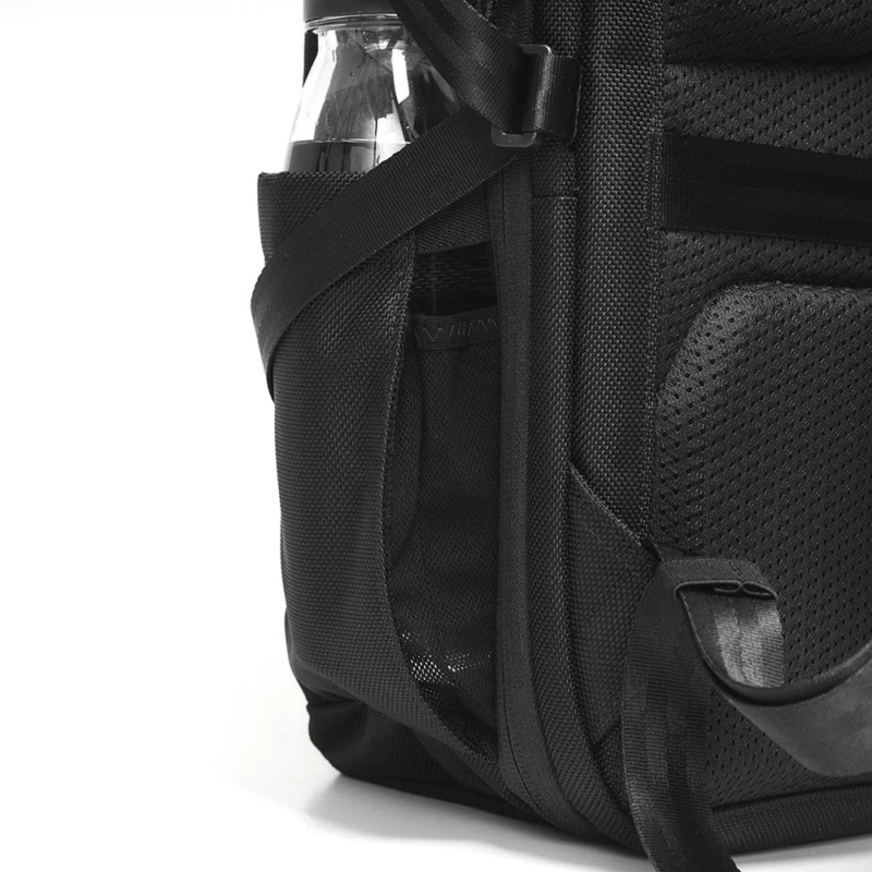 Side pocket with water bottle in Incase Tracks Expansion Backpack