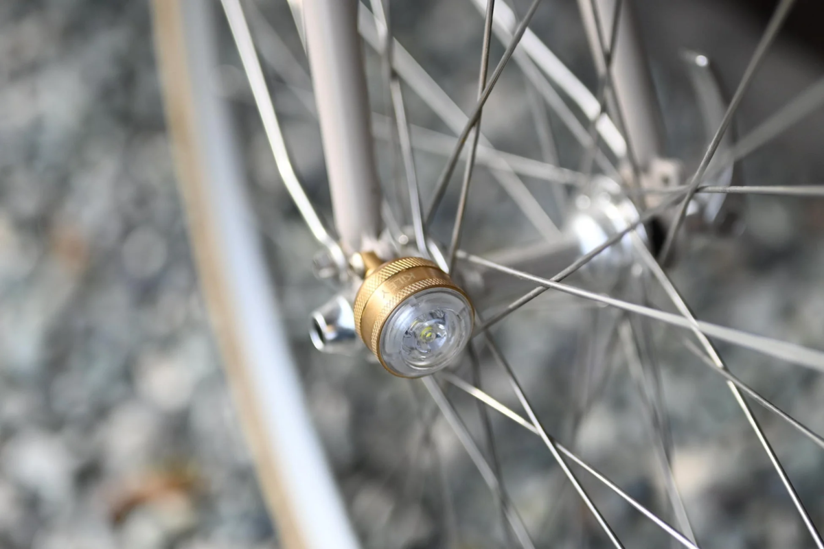 KiLEY Brass Light on a Bicycle Wheel