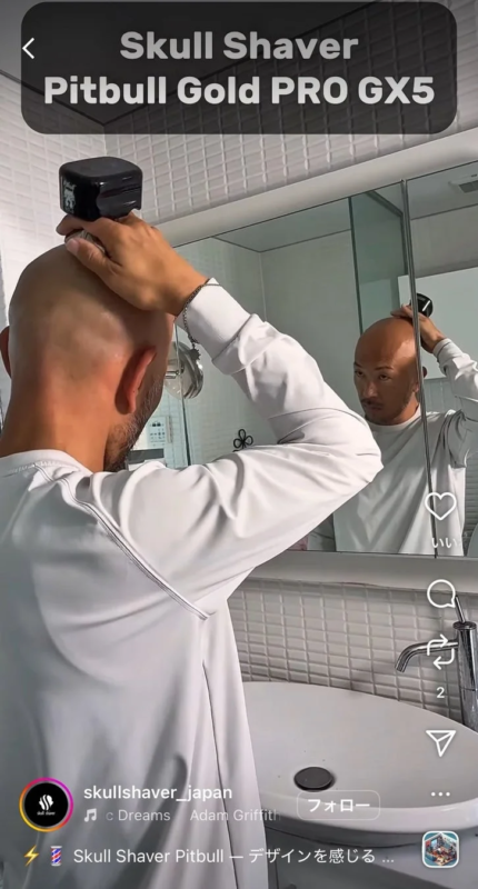 Man shaving head with Skull Shaver Pitbull