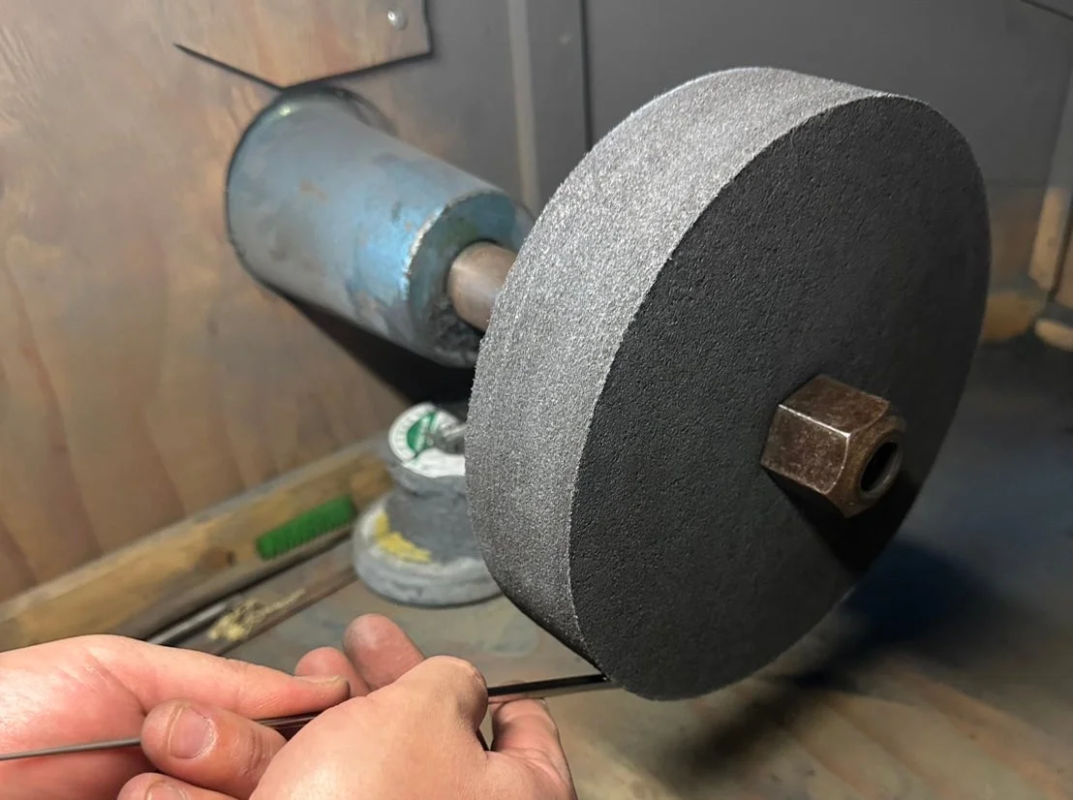 Grinding metal in a workshop