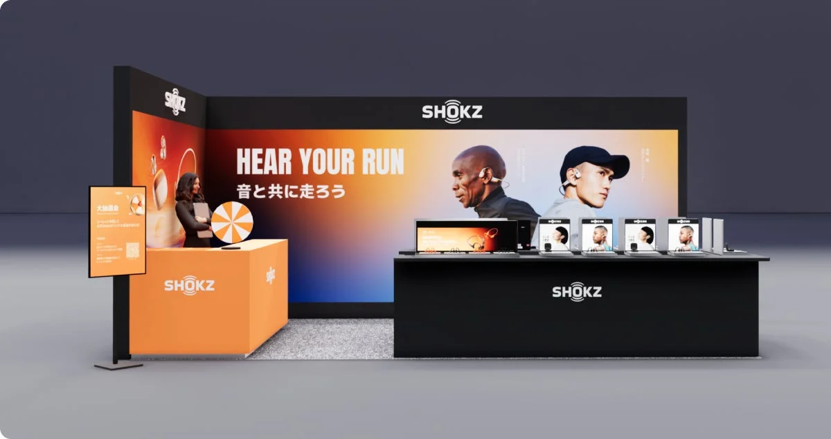 SHOKZ event booth with "HEAR YOUR RUN" slogan