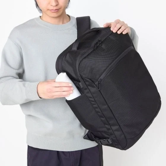 Man putting bottle into side pocket