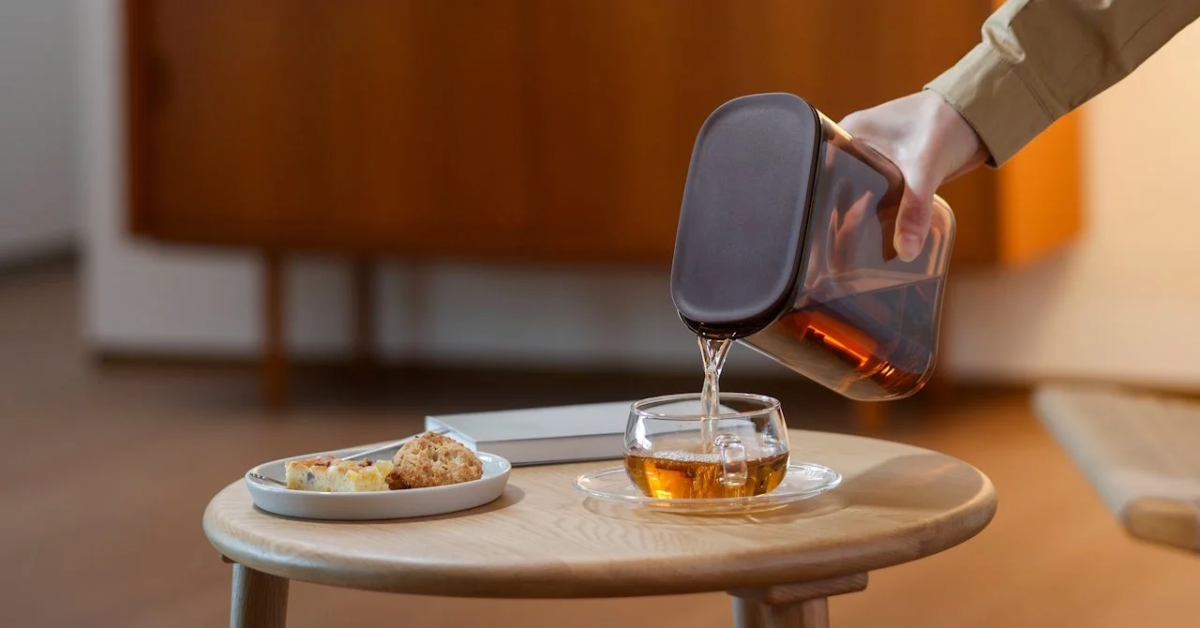 Pouring tea from pitcher