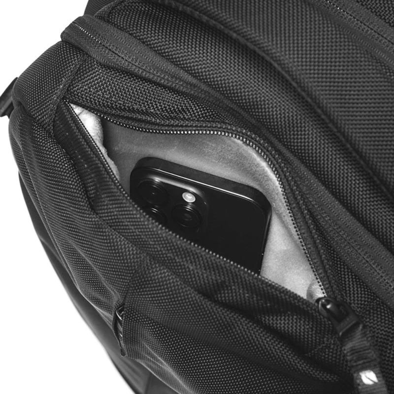 Smartphone in top pocket of Incase Tracks Expansion Backpack