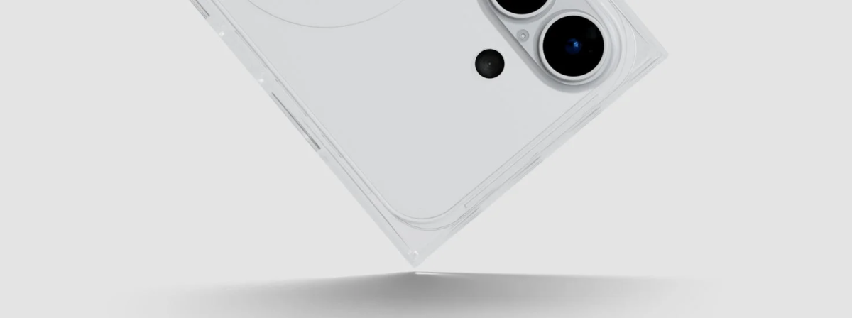 Close-up of the back of a white smartphone with dual cameras, showing its corners touching a surface