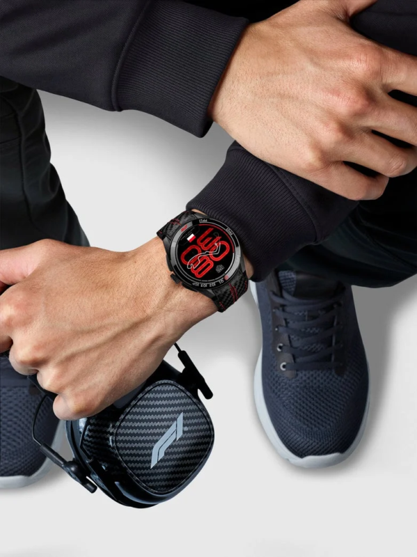 Person wearing TAG Heuer Connected Calibre E5 45 mm x Formula 1® with F1® headphones