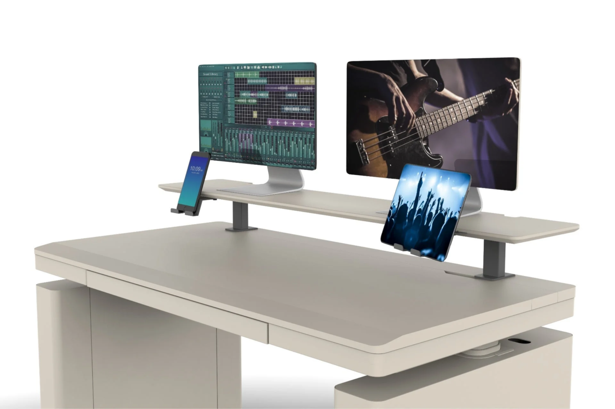 Modern desk setup with multiple screens and devices