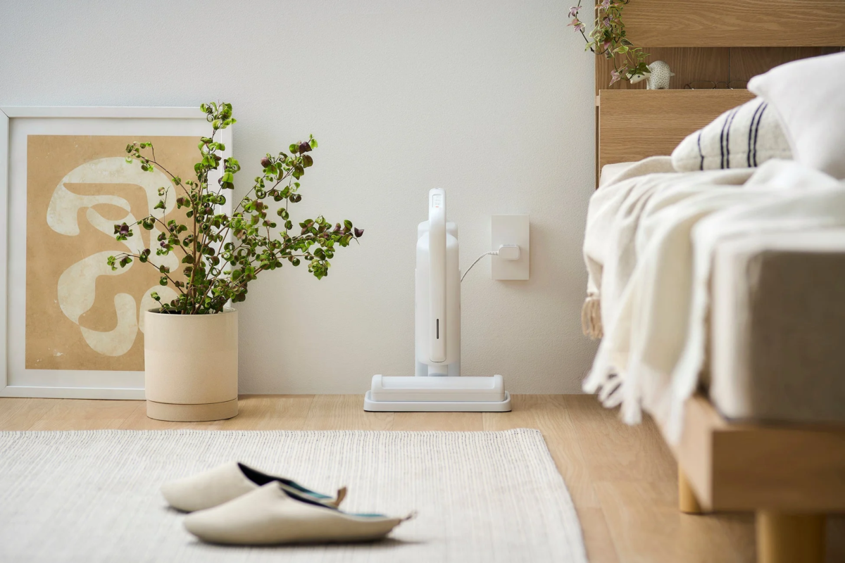 Cordless cleaner charging on a stand
