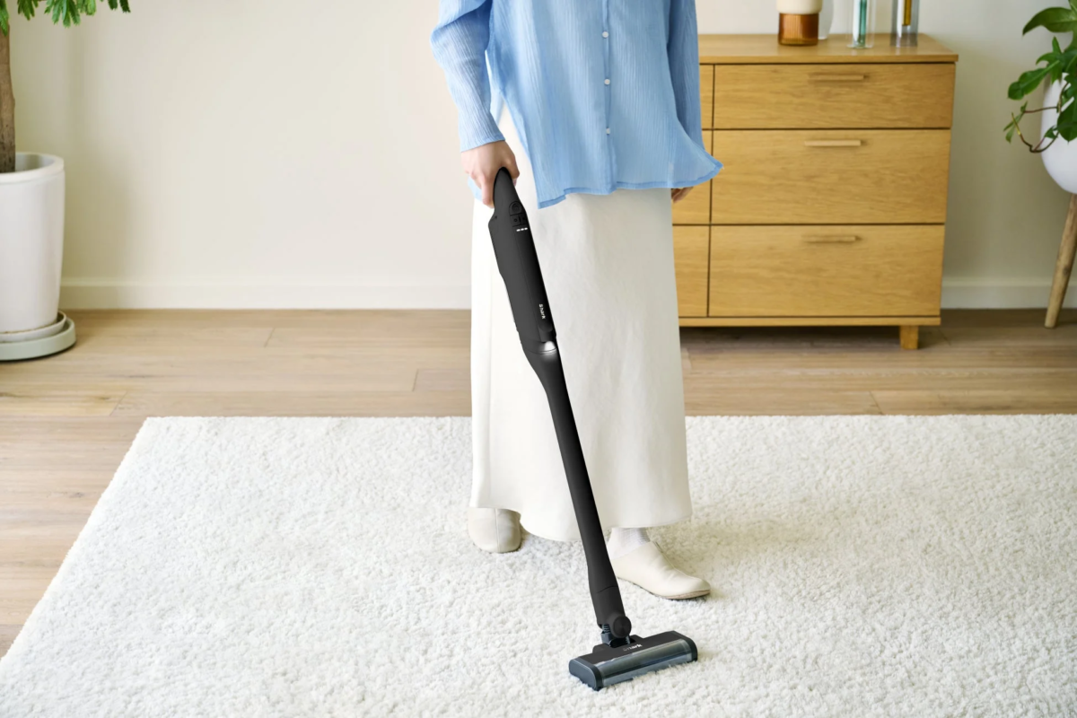 Woman cleaning carpet with Shark EVOPOWER DX