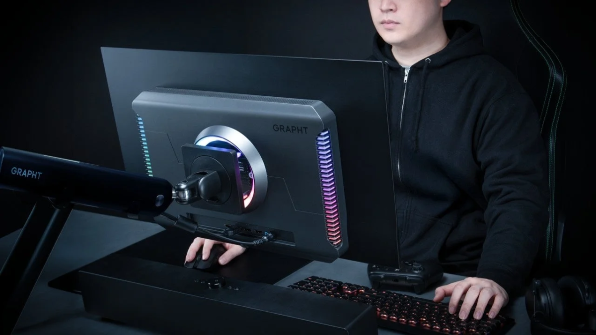 Gamer at desk with monitor arm