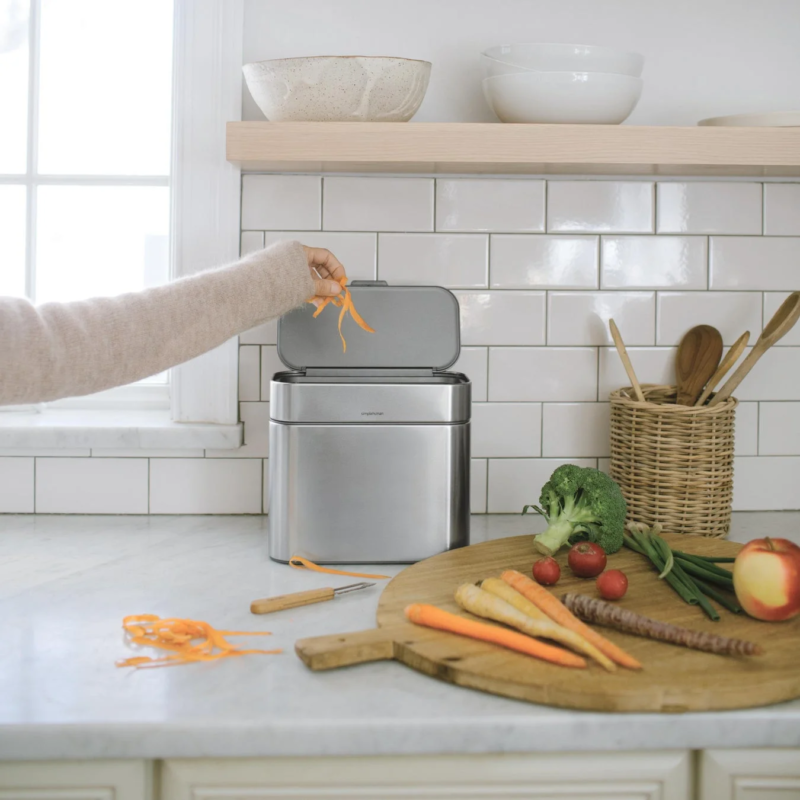 Peeling carrots directly into the compost caddy