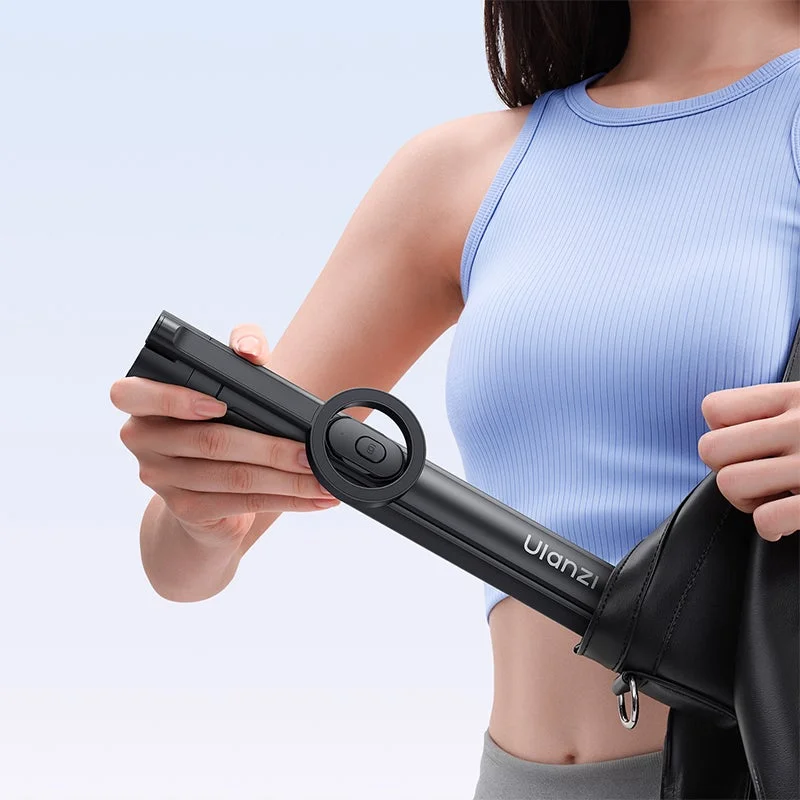 Woman putting Ulanzi device in bag