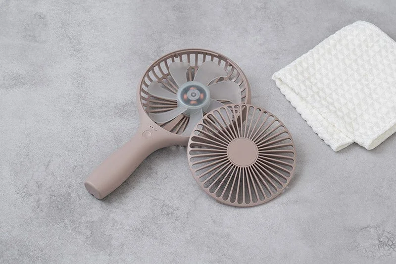 The front guard of the Uchiwa Handy Fan removed, showing its easy cleaning feature