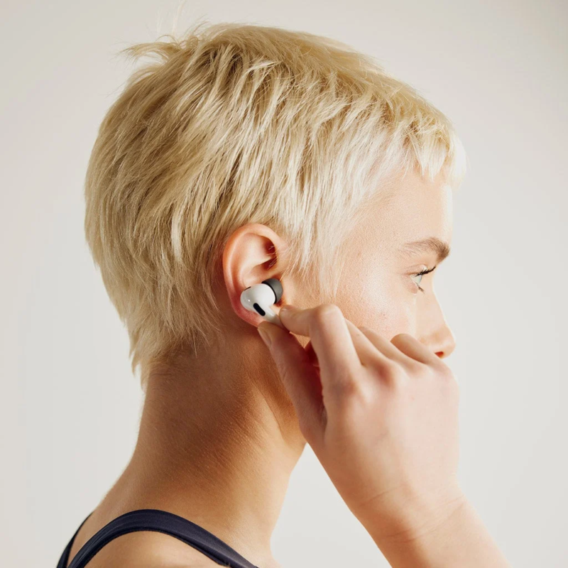 Woman wearing AirPods Pro with ear tips