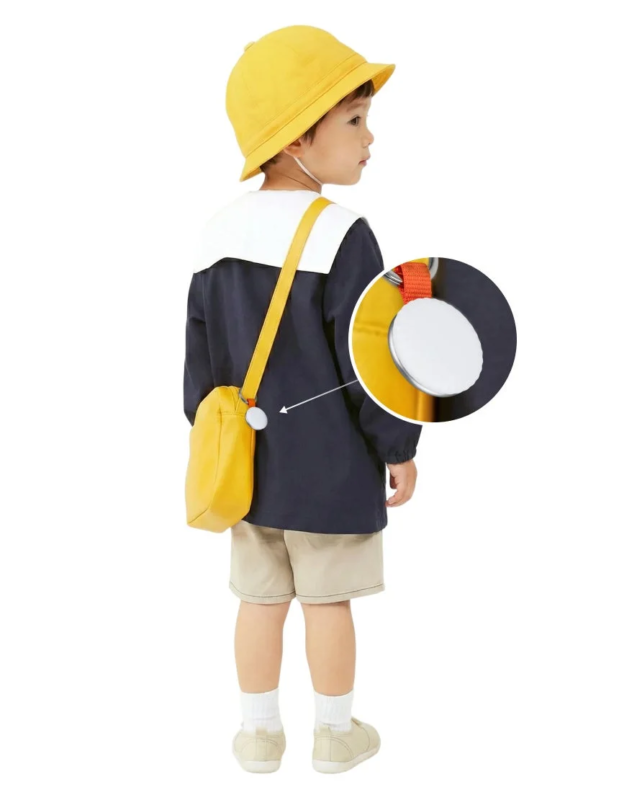 Child with Tag.O on backpack