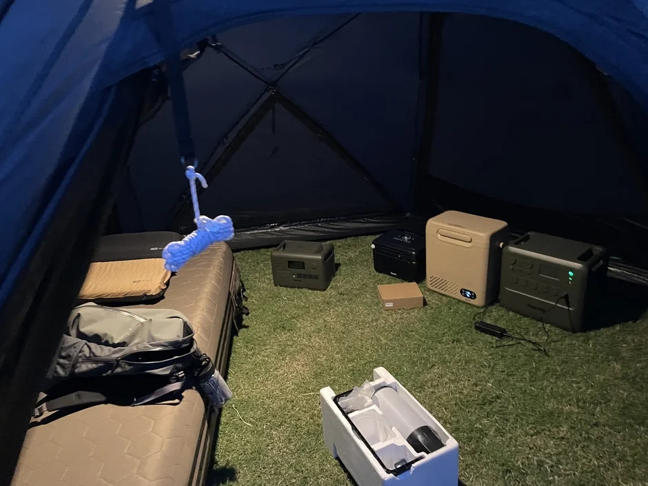 Portable refrigerator at a campsite