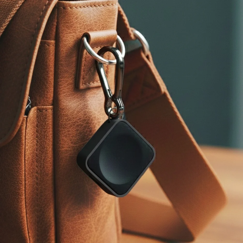Black portable charger on a bag