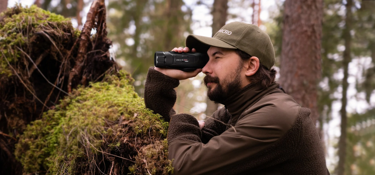 Man using a HIKMICRO LYNX 3.0 in a forest