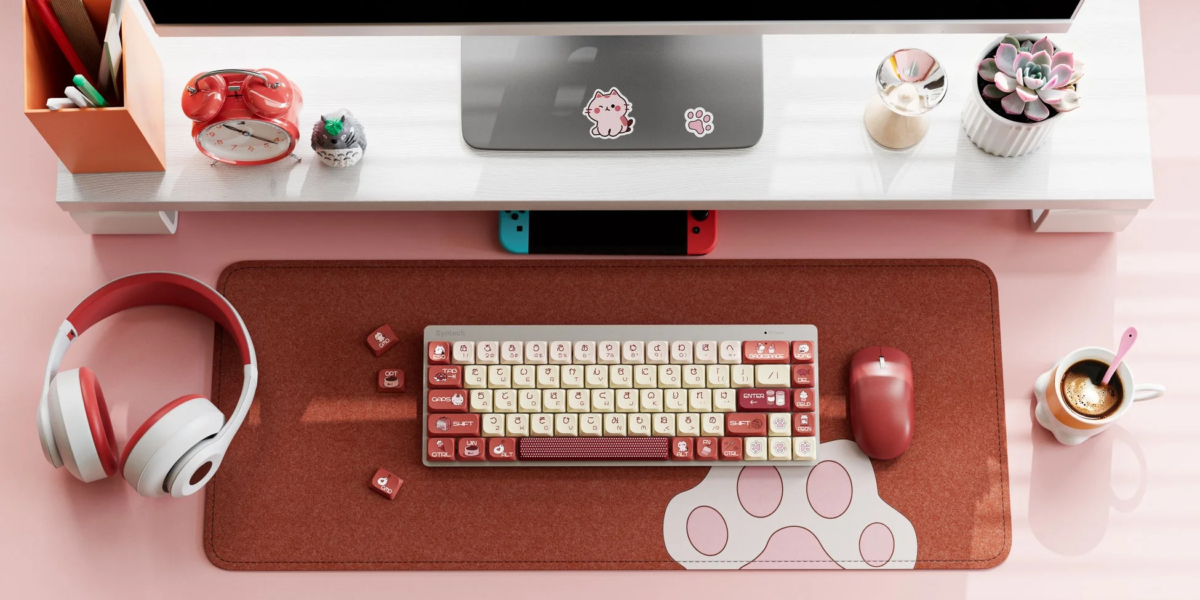 Cat-themed keyboard and desk setup