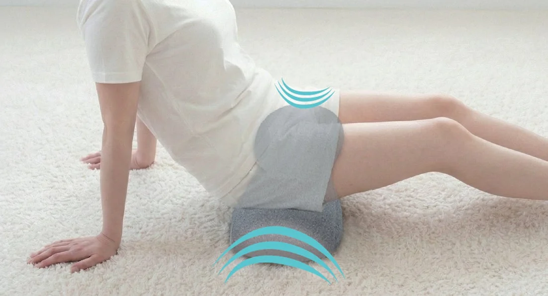 Person stretching with cushion, sitting