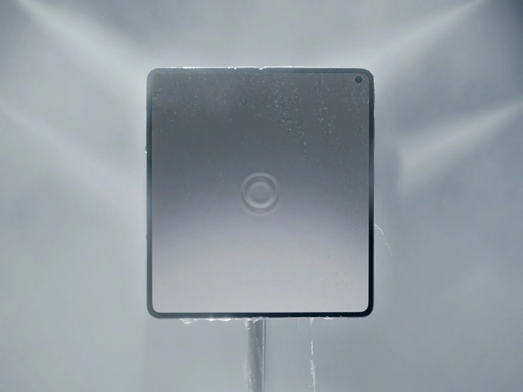 Water being sprayed onto a smartphone