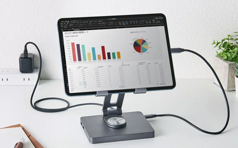 Tablet on stand displaying data analysis sheet