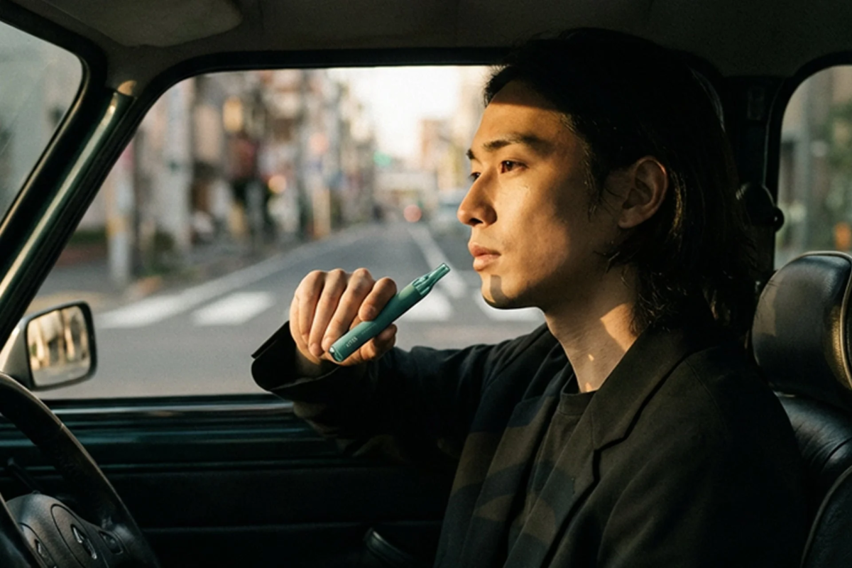 Man in car with OXIA