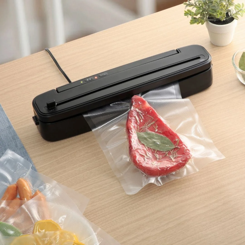 Vacuum Sealer in use with meat