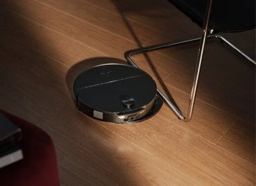 Robot vacuum under a chair