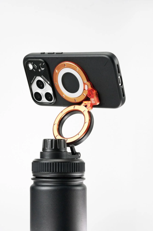 iPhone with MagSafe ring on bottle