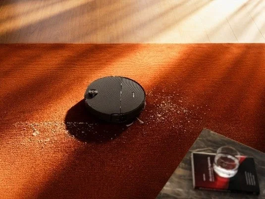 Robot vacuum cleaning a carpet