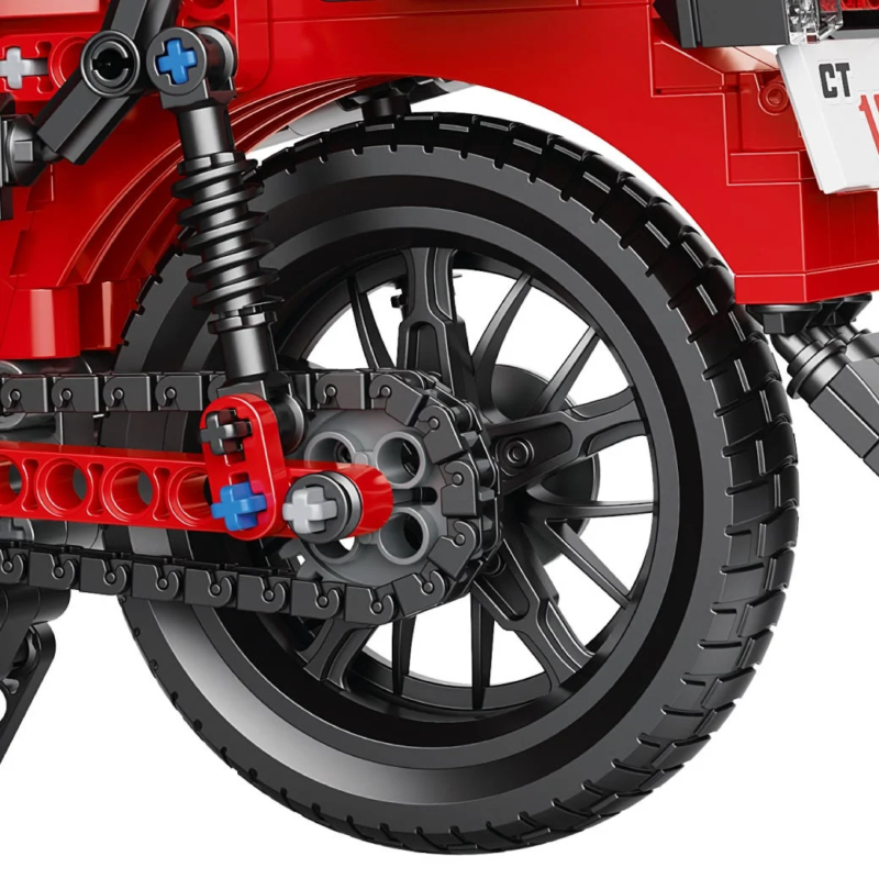 Toy motorcycle rear wheel close-up, red block design