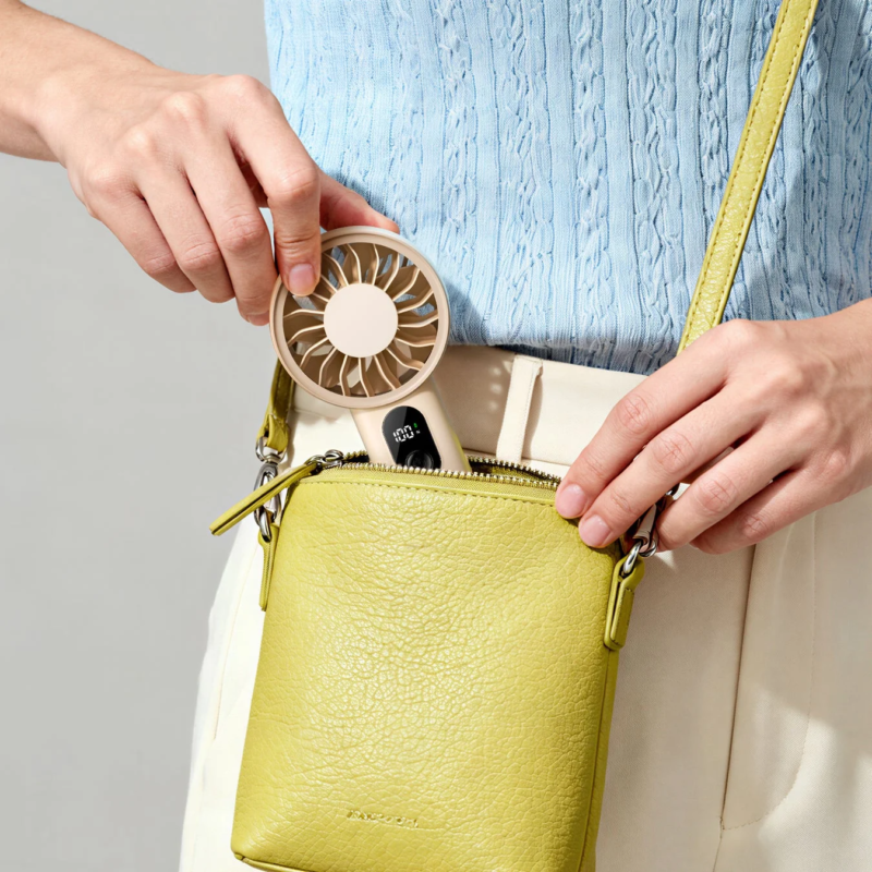 Aecooly Handy Fan being placed into a bag