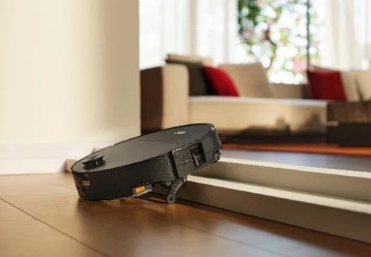 Robot vacuum climbing a step
