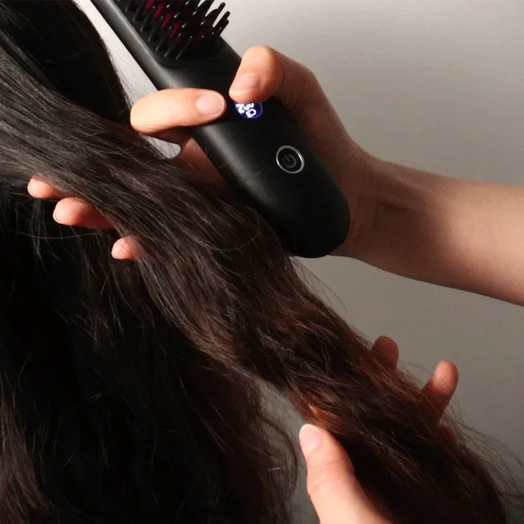 Woman Using Hair Iron Brush at 180°C