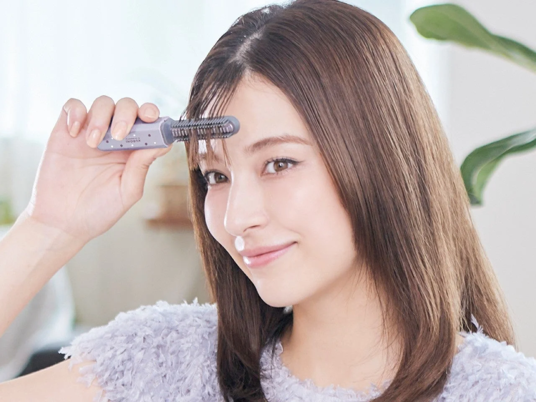 Styling bangs with the Cordless Bang Hair Iron