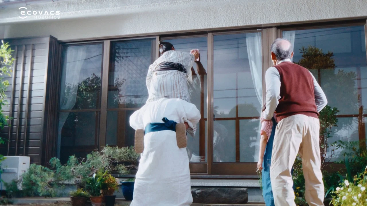 Family doing window cleaning, comical