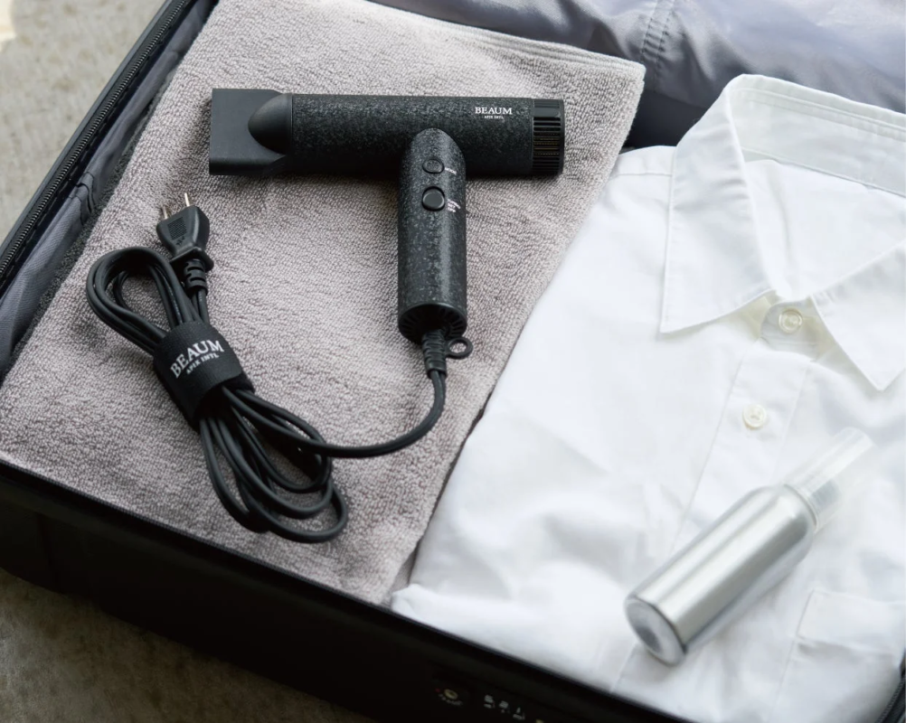 BEAUM TINY FLOW Hair Dryer packed for travel