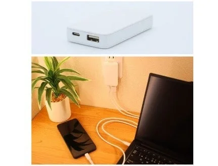 Nitori PD Compatible 65W Slim USB Charger charging a smartphone and a laptop on a desk